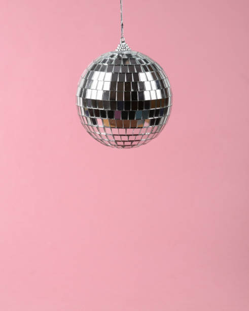 istock Disco ball on a pink background. Minimalism party concept 1359676626