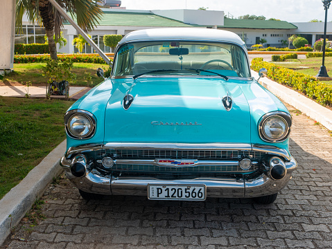 Cayo Coco, Cuba, 25 may 2021: Chevrolet Bel Air car is parked outside a Cuban hotel Tryp Cayo Coco. The bright blue 1949 car enjoys great attention from tourists.