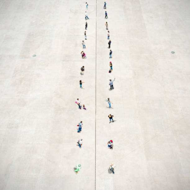 istock People standing on two separated zones 1359676929
