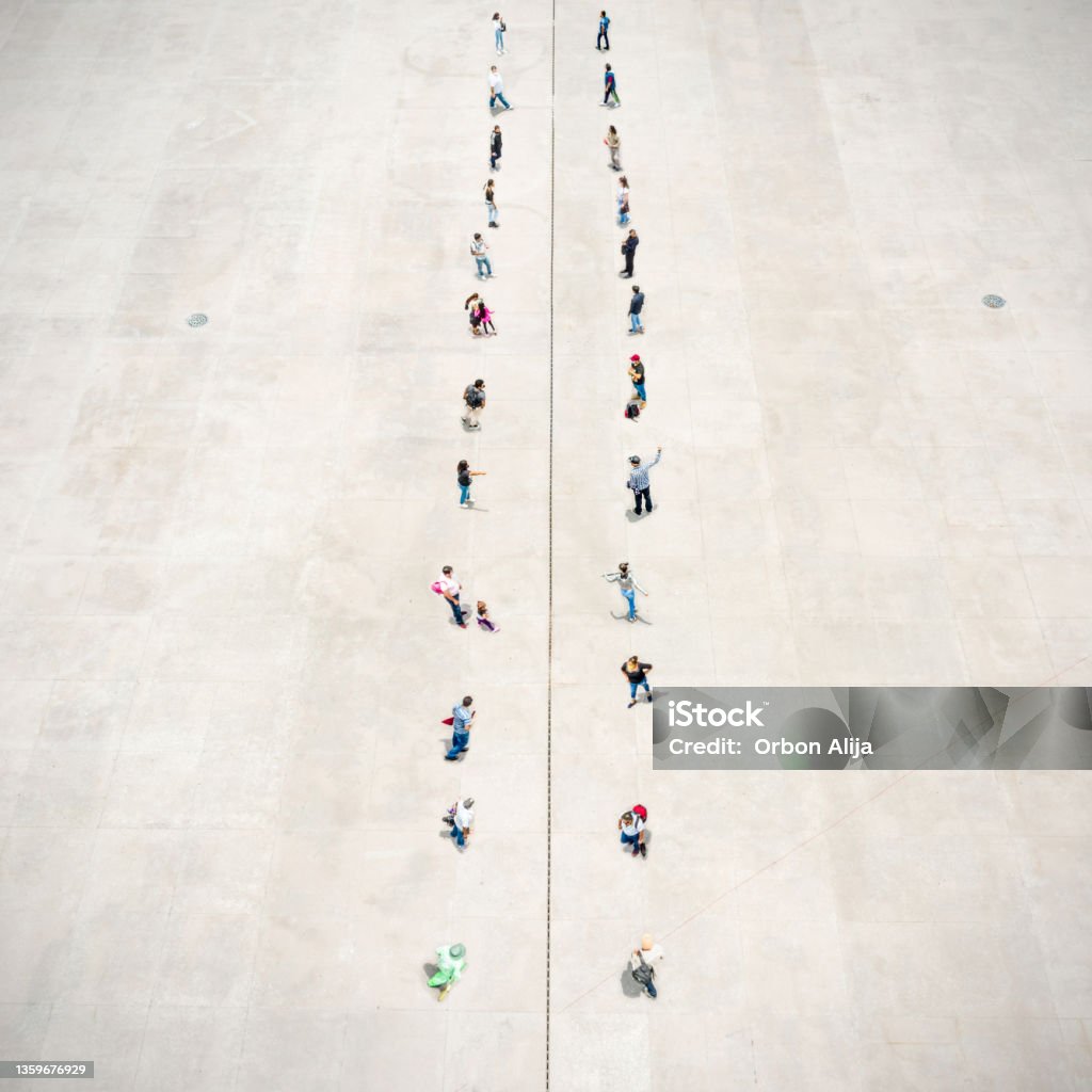 People standing on two separated zones Dividing Stock Photo