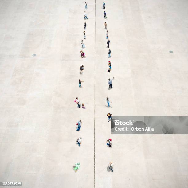 People Standing On Two Separated Zones Stock Photo - Download Image Now - Dividing, Separation, Politics