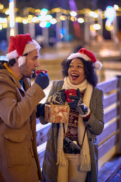 istock Beautiful couple on a date in a Christmas night 1359676946