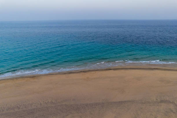 istock Sandy beach near blue sea 1359677866