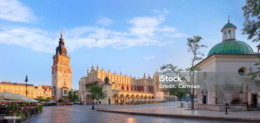 Panorama of the Market Square in Krakow, Poland, a view of the Town Hall, the Church of St. Wojciech and the Cloth Hall Panorama of the Market Square in Krakow, Poland, a view of the Town Hall, the Church of St. Wojciech and the Cloth Hall. Krakow Stock Photo