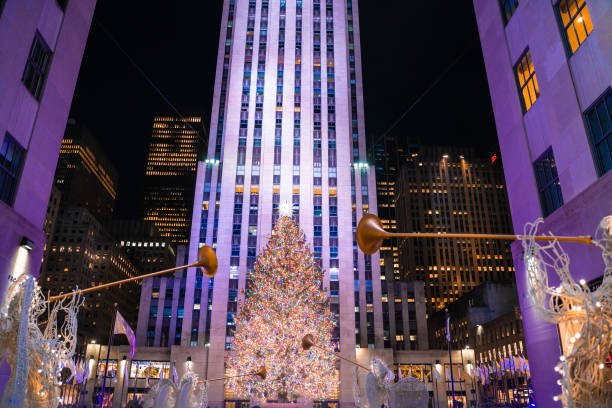 Christmas tree at Rockefeller Plaza in Midtown Manhattan New York City New York City, New York, USA - December 15, 2021:  View of famous Christmas tree at Rockefeller Plaza in Midtown Manhattan New York City seen on a December night with lights rockefeller ice rink stock pictures, royalty-free photos & images