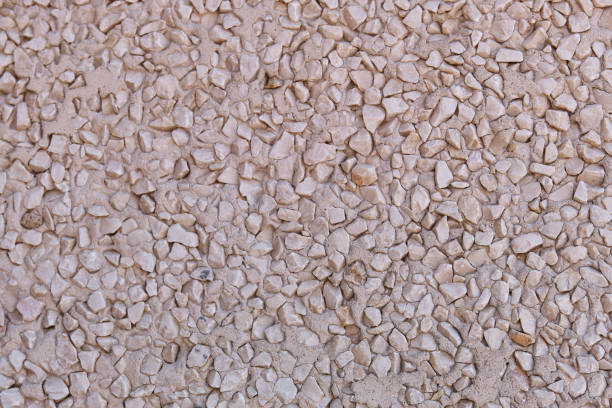 istock beige color gravel work wall texture 1359688020