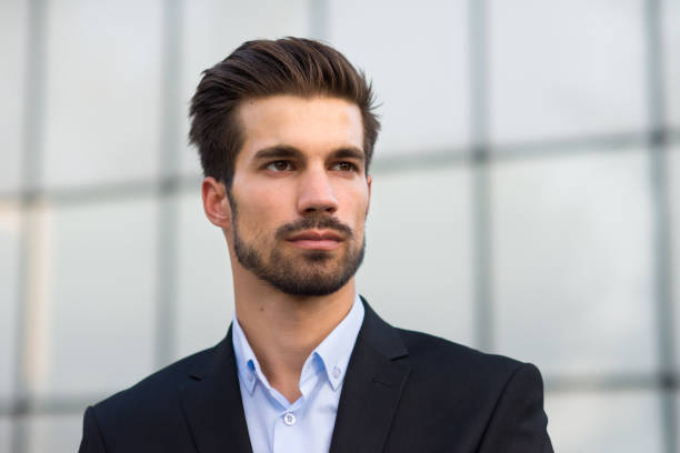 istock Businessman in front of office building 1359693136