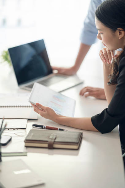 istock Business people  discussing and analyzing business strategy at office. 1359694783