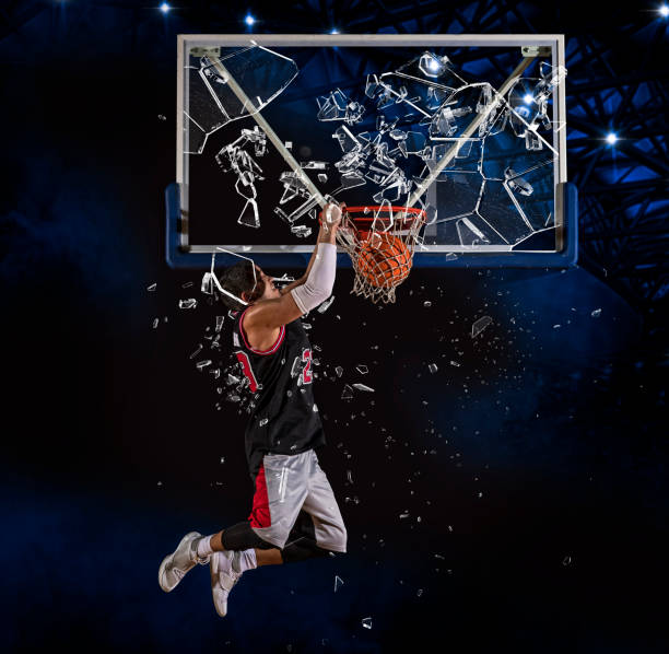 istock Basketball player players in action. Shattered backboard 1359695112
