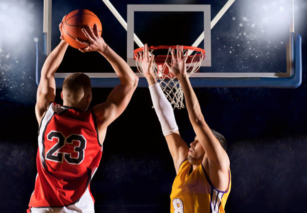 istock Two basketball players in action 1359695114