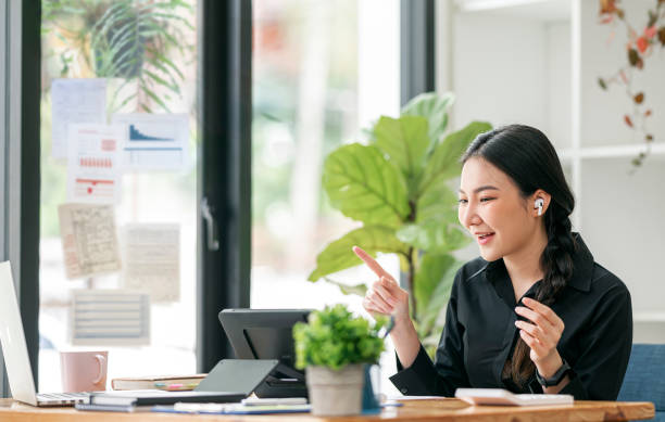 istock businesswoman speak using video conference on laptop. 1359696023
