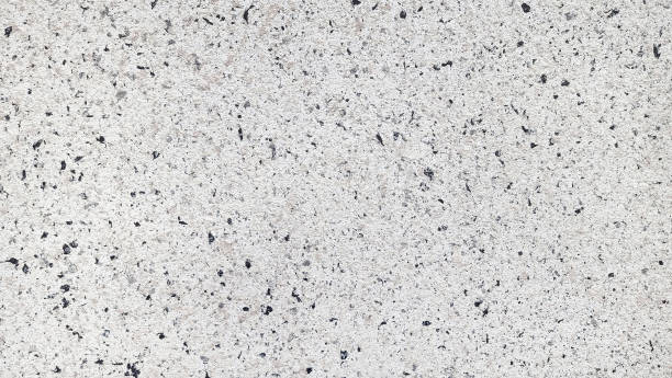 istock abstract white or grey stone cement wall teture use as background. grungy, grainy and stained concrete wall. textured grey special spray paint for architectural exterior facade. terrazzo wall. 1359696139