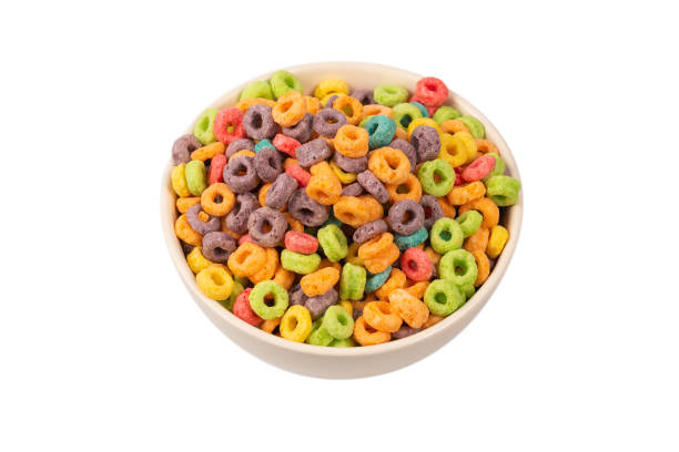 istock Colorful rings cereal spill out into a bowl. Breakfast. Isolated. 1359697274
