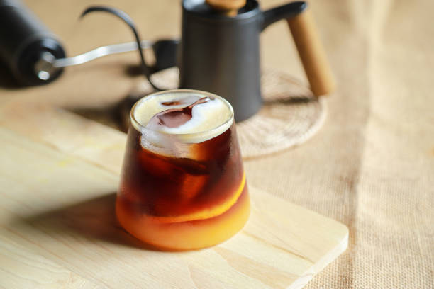 istock fresh americano oragne coffee from fresh making drink for relaxing in home 1359697329
