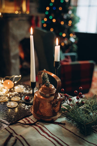 istock Decorated New Year's table with candles and antique teapot 1359698075