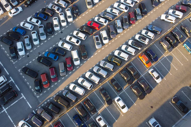 istock Cars at parking aerial view 1359698277