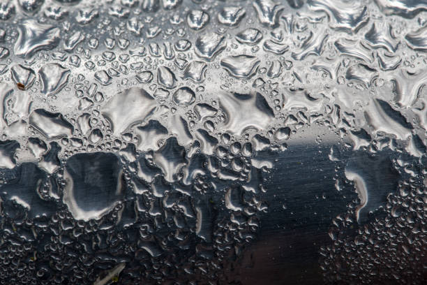 istock Drops of water on a discarded aluminum beverage can. 1359713125
