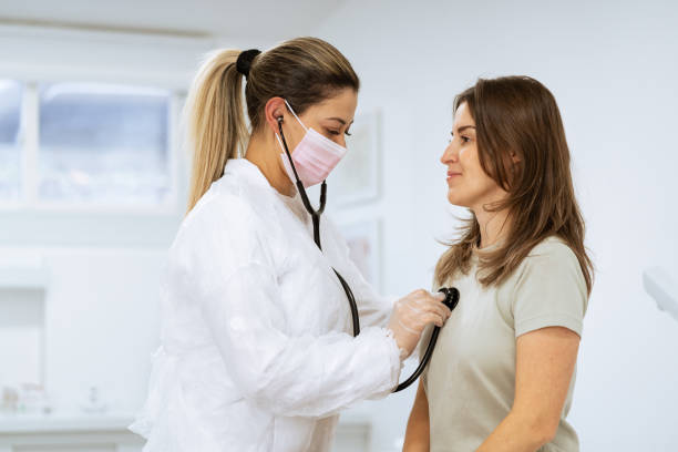 istock Female doctor performing a physical examination on the client 1359714223