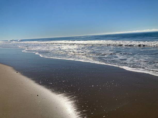 istock Bright Sun shines at the water’s edge on a sunny morning 1359715831