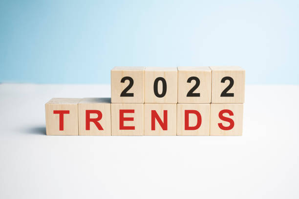istock 2022 trends on wooden cube blue background, copy space. 1359717778
