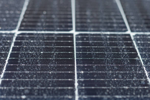 istock Solar panels with drop of water after rain. Selective focus 1359720304