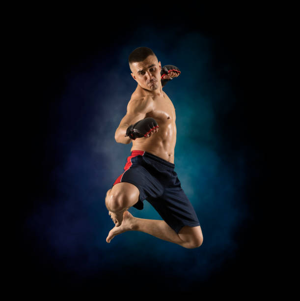 istock MMA male fighter kick 1359720510