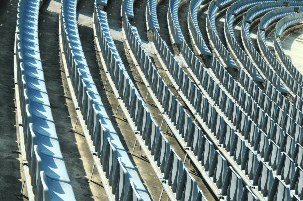 istock Rows of empty stadium seats during COVID-19 pandemic. 1359731852