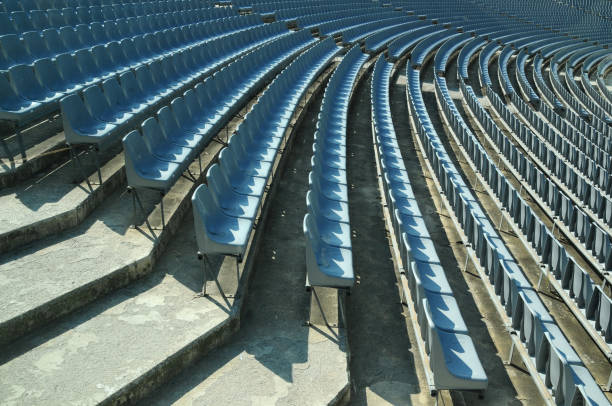 istock Rows of empty stadium seats during COVID-19 pandemic. 1359731856