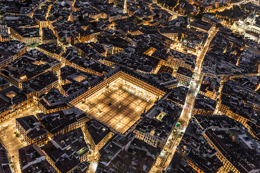 Night aerial views of Plaza Mayor and its confluence with Calle Mayor and Calle Atocha in the city of Madrid