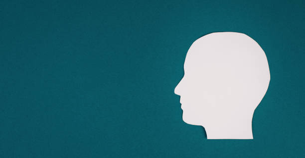 istock Paper cut out head, symbolic for brainstorming, having an idea, new concepts, copy space for text 1359733844