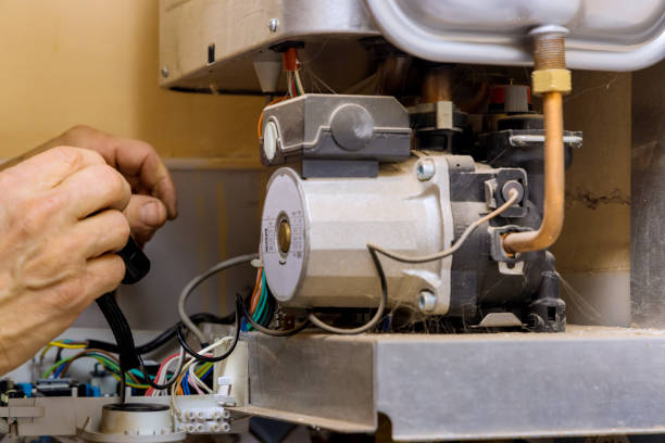 istock Tehnic fix the problem servicing on gas boiler for hot water and heating 1359733866