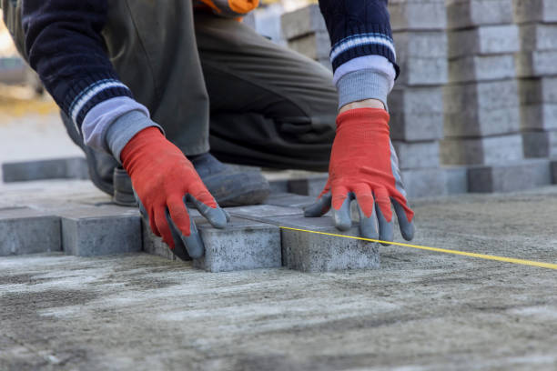 istock Graystone pavers installation pavers installed in a running bond pattern on a sandy base 1359733872