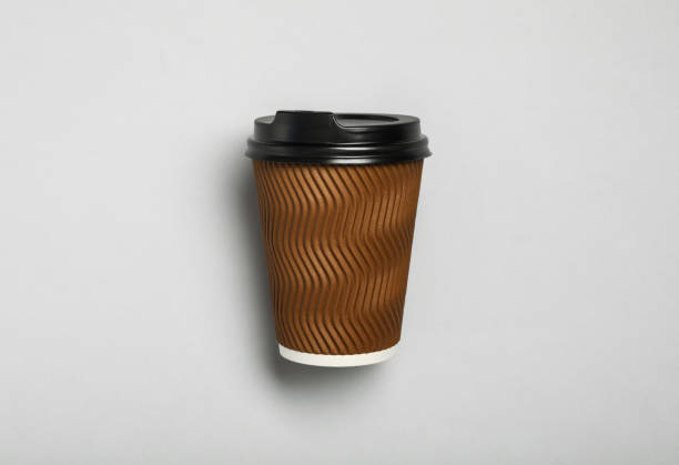 istock Takeaway paper coffee cup on light grey background, top view 1359736199