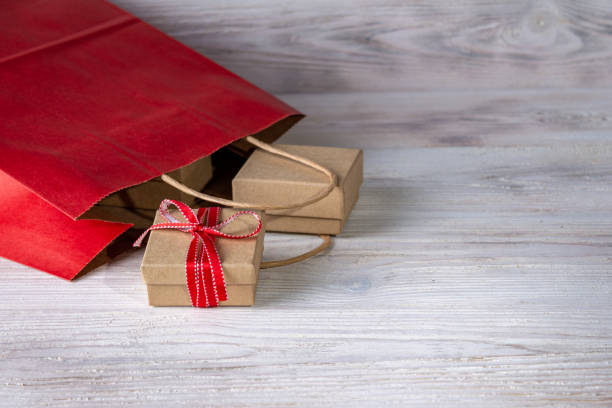 istock gifts in boxes for needlework, red paper bag, place for text 1359736408