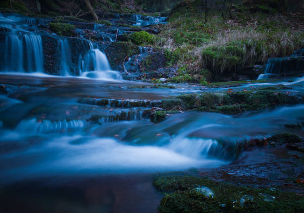 istock Wild brook with stones and waterfall in Jeseniky mountains 1359740098
