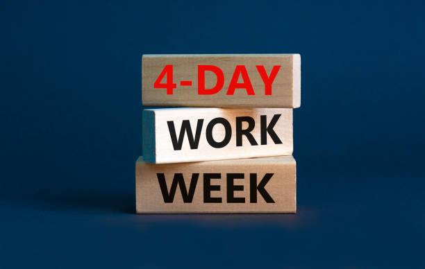 4-day work week symbol. Concept words '4-day work week' on wooden blocks. Beautiful grey background. Copy space. Business and 4-day work week concept. stock photo
