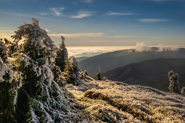 istock View from mountain range to the valley above fog and clouds 1359740913