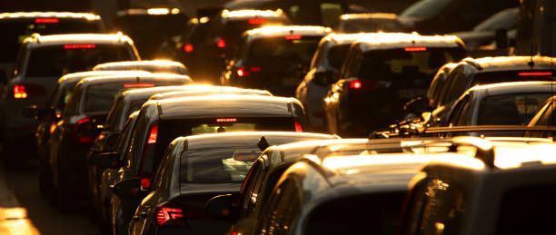 istock Car traffic jam at sunset selective focus. 1359741095