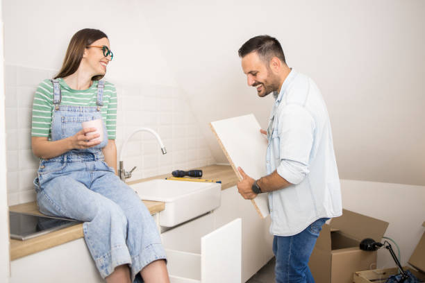 istock Happy couple making a kitchen at their new house 1359743030