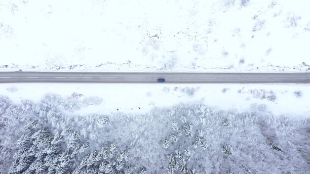 istock Car driving on winter country road 1359746668
