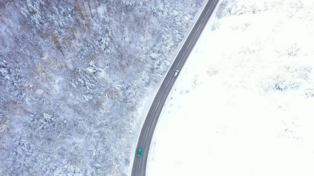 istock Car driving on winter country road 1359746712