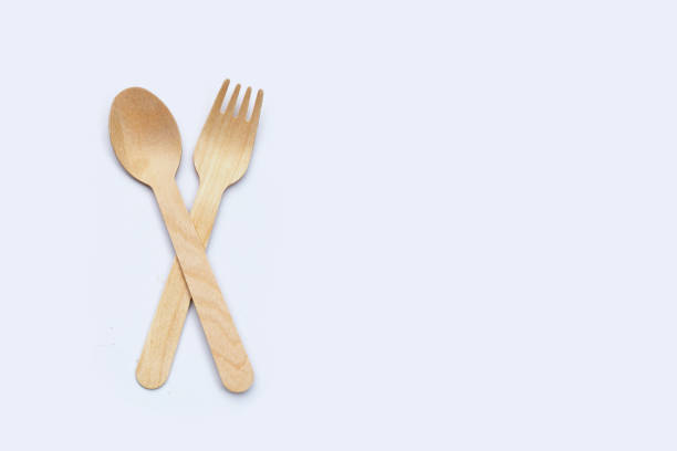 istock Wooden spoon and fork on white background. 1359750114