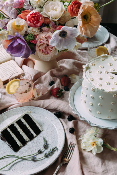 istock Flowers in vase with cake 1359750865