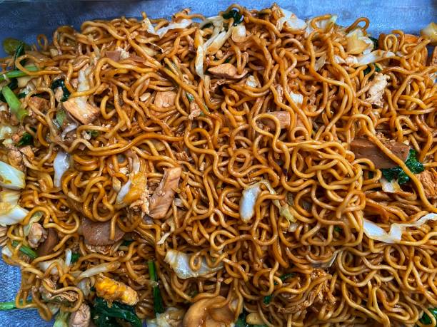 istock Fried noodles with mustard, cabbage, chicken slice and meatballs 1359750991