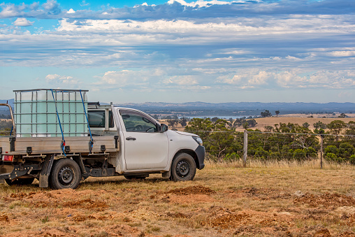 White utility vehicle with views across rural Victoria