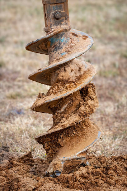 istock Post hole digger in rural Victoria 1359753694