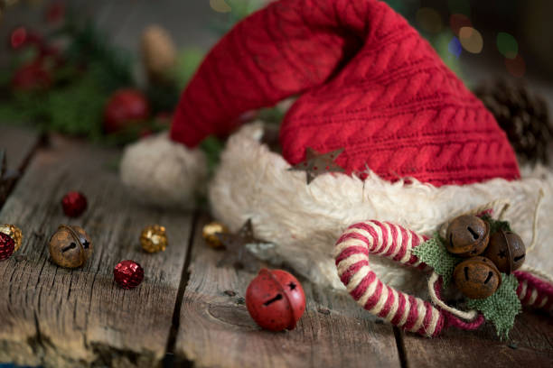 Santa Hat with Christmas Bokeh Lights on a Rustic Wood Background