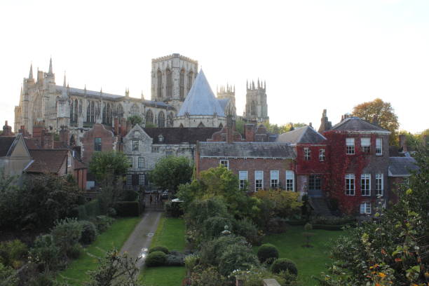 istock York minster with different type of homes in garden 1359756349