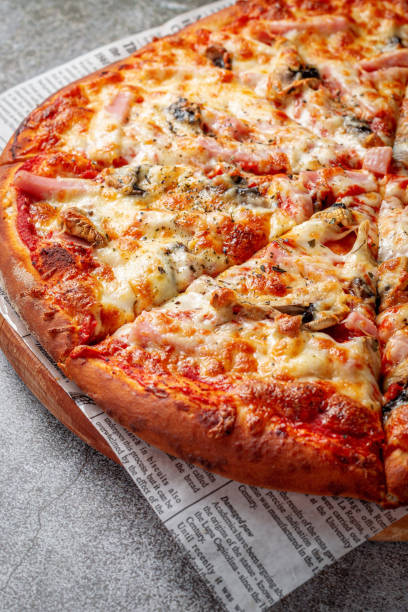 istock Fresh delicious Italian pizza on a gray stone table background 1359757012
