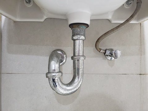 stainless steel pipe at the bottom of the sink for the dirty water drain